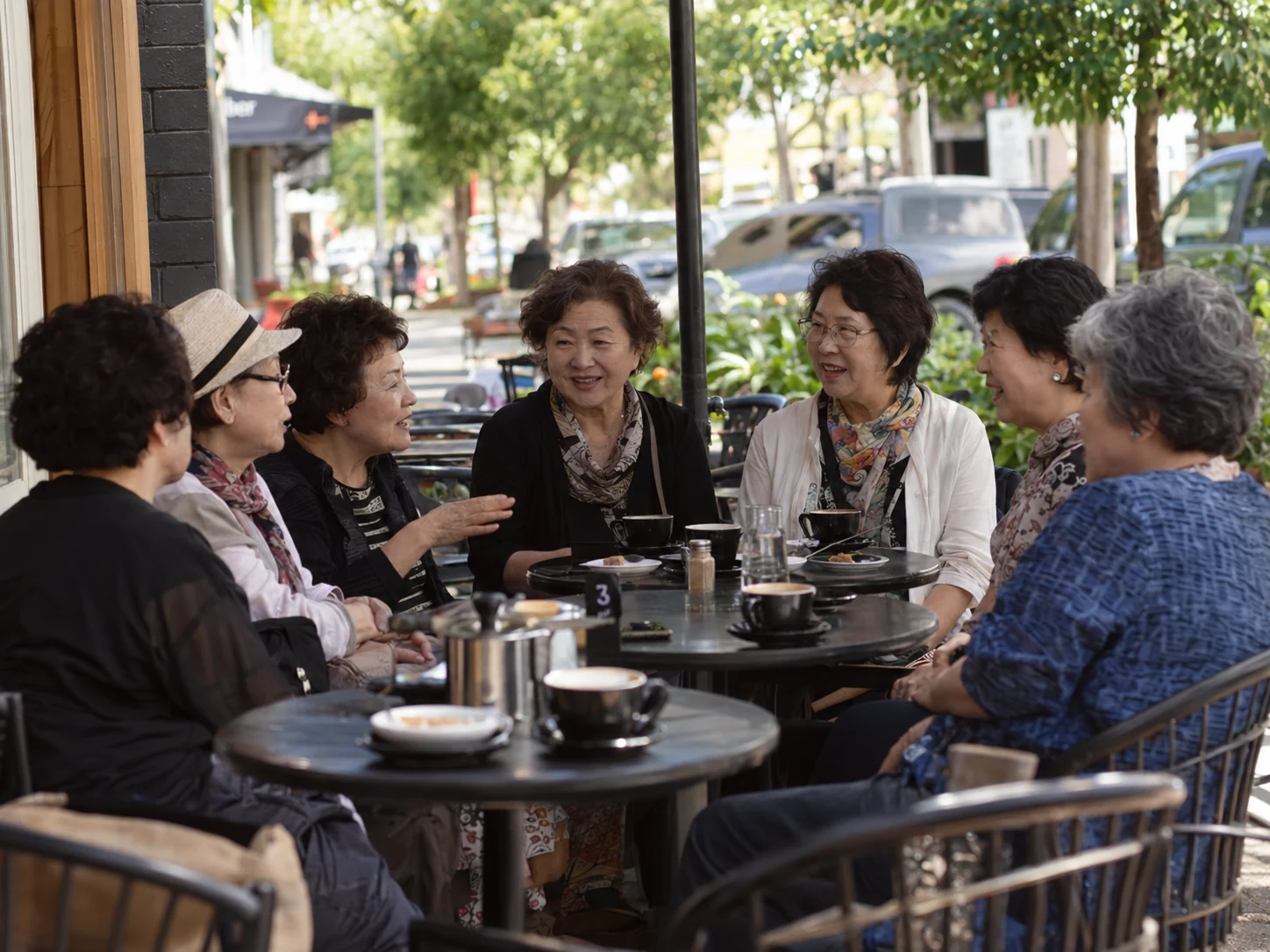 Group of older Korean women socialising together at a local cafe